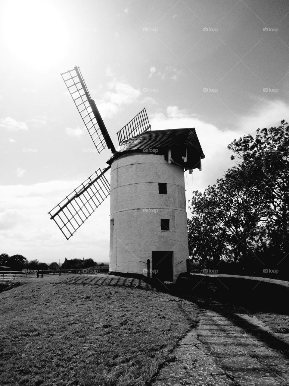 black and white photo of a windmill