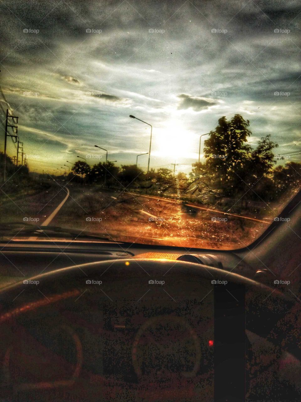 Car driving to see the sunset.