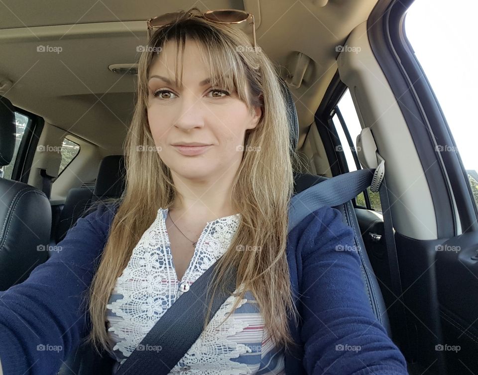 Young woman driving car