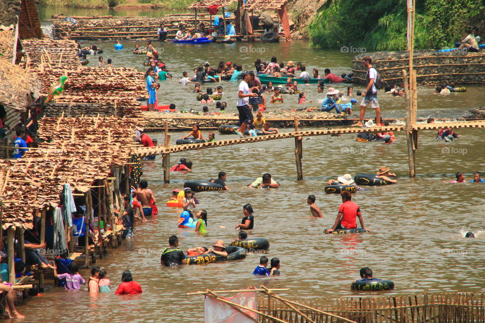 People swim in the river to cool off and have fun.