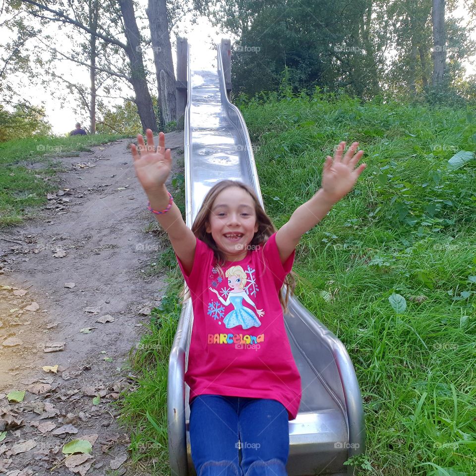 On a playground with a slide