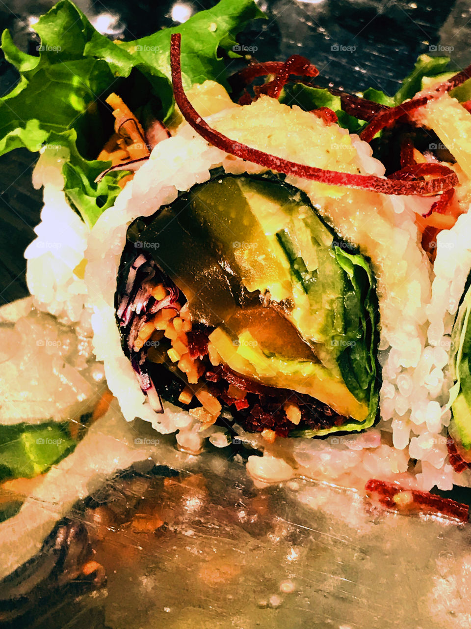 Closeup of vegan sushi; radish, beet, carrots, cucumber, mushroom, tofu, avocado, lettuce, cucumber. We were celebrating my husbands birthday at our fav sushi restaurant! Yummy! 🥢