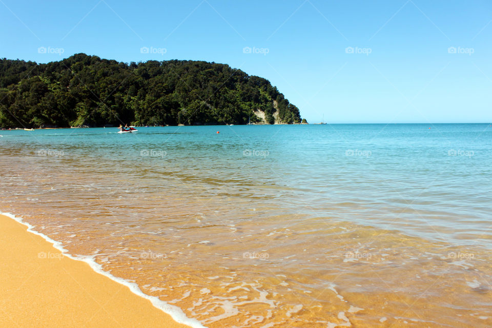 View of a beach against clear sky