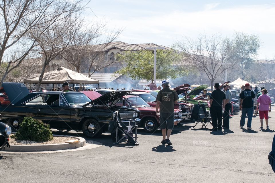 People looking at cars at the classic car show