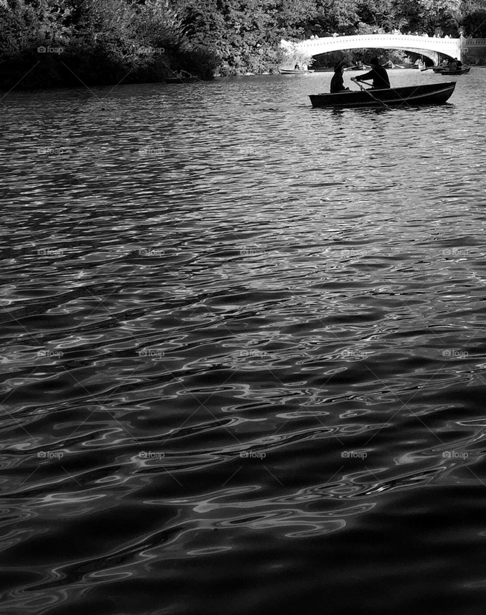 Couple in a boat at Central Park lagoon 