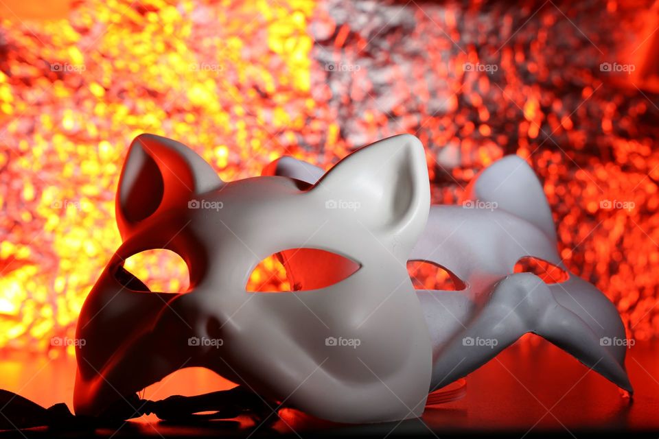 Close-up of masks with red light