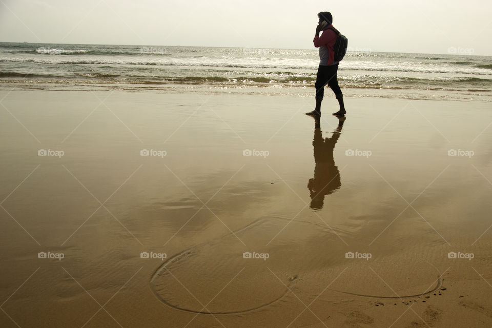 Silhouette of young man in beach