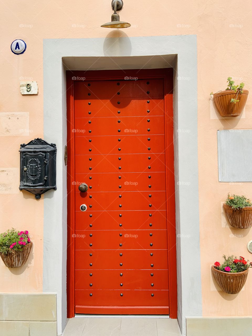 Red door with flowers 