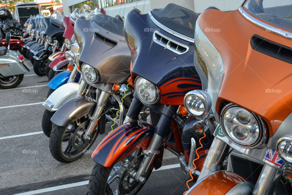 a large collection of motorcycles parked outside a hotel in Denmark.