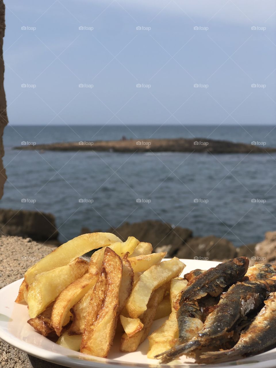 Sardines and French fries goes perfectly together 