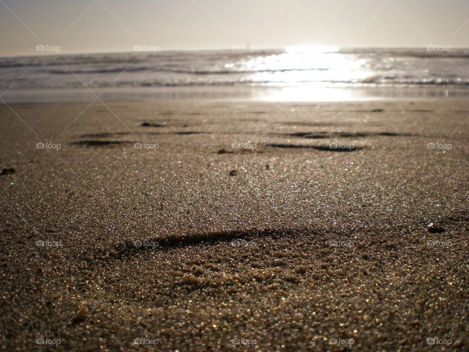 Sunken footsteps in sand