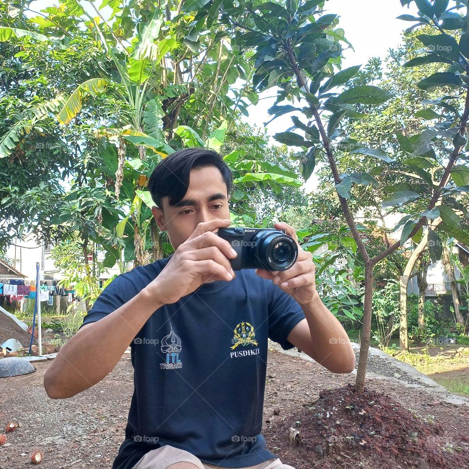 a young man who is aiming