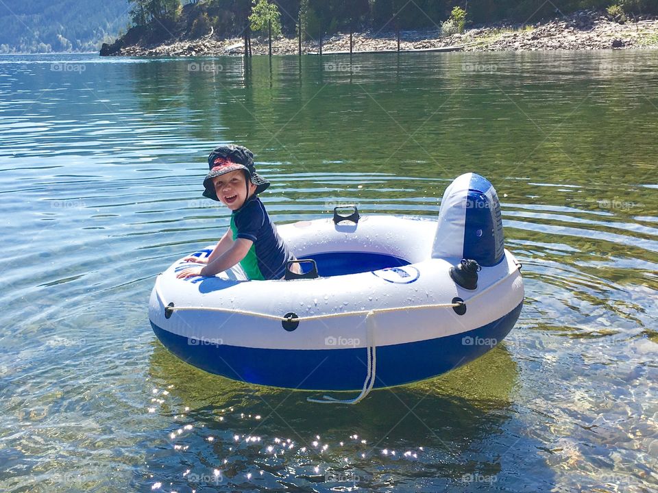 Fun in a blow up tube on Kootenay lake in British Columbia. 