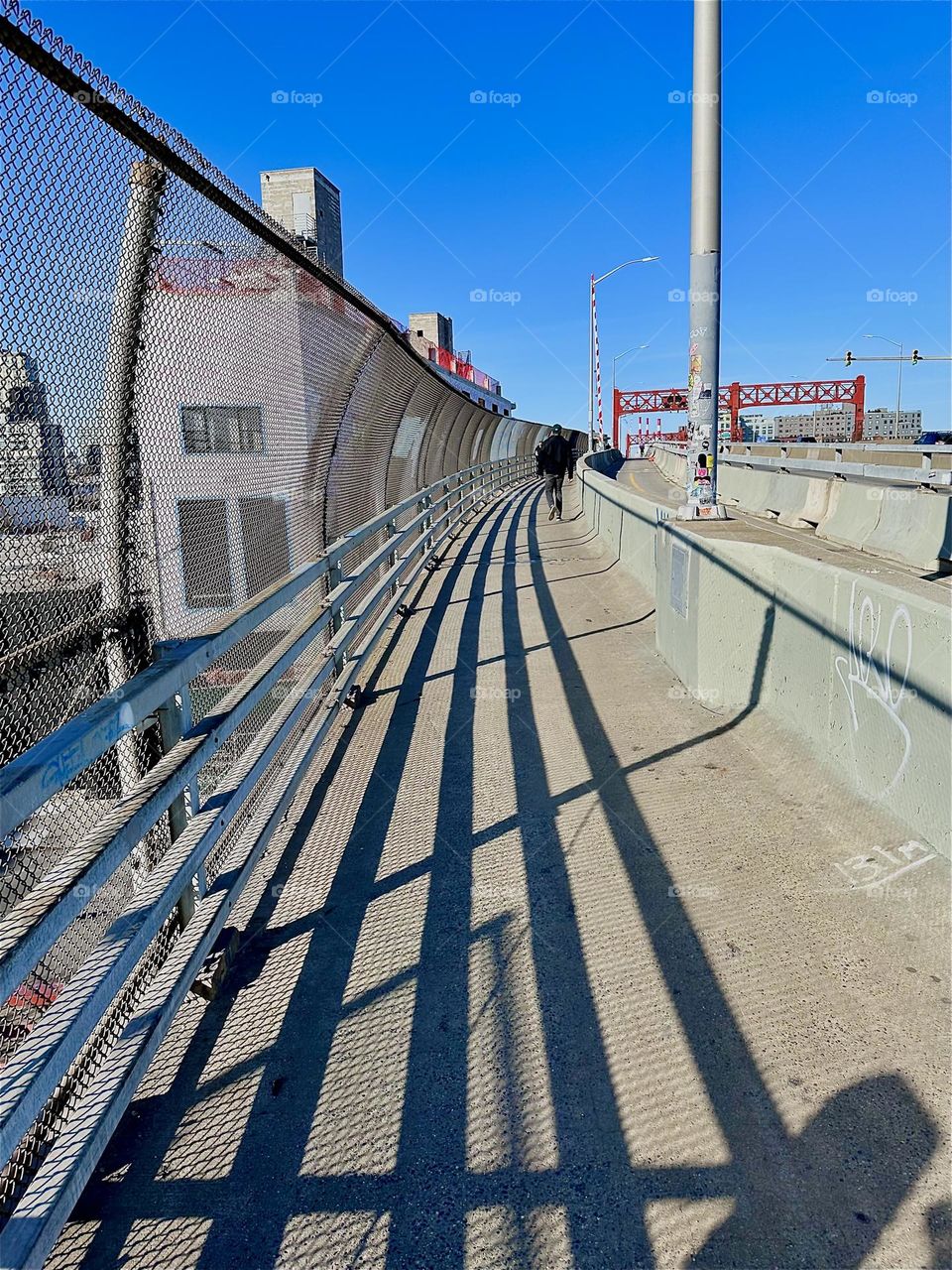 The minimalist aesthetic of the “Pulaski Bridge” at “Newtown Creek” that connects “Greenpoint”, Bklyn to LIC, Queens is convincing in its simplicity. On a sunny day the structures are further enhanced by the shadows cast. 2023. Hypnotic Productions