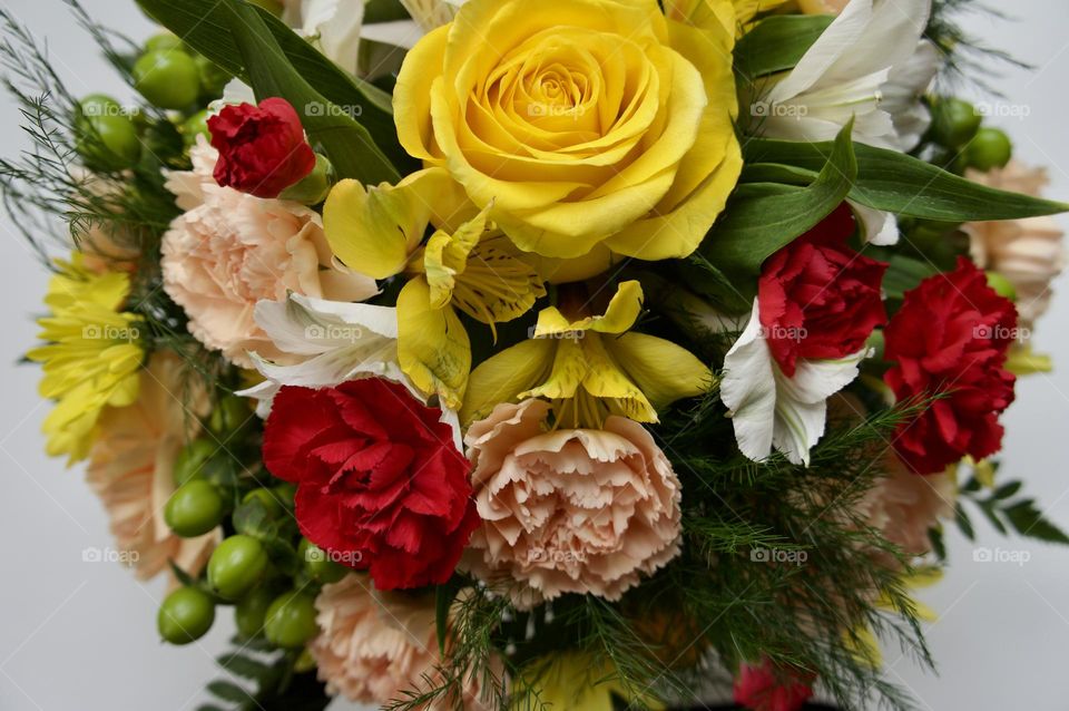 A lovely bouquet of carnations roses and lilies.