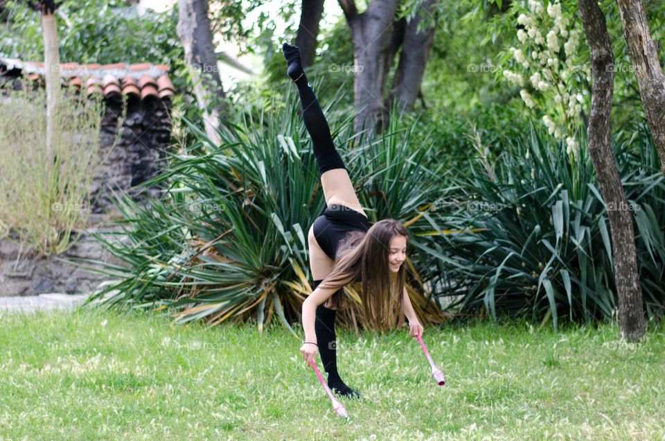 Beautiful Young Gimnast Dancing in Nature