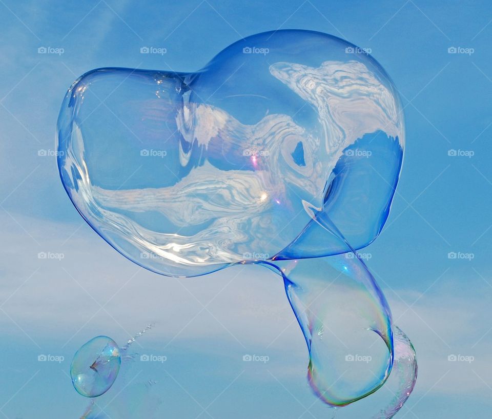 Soap bubbles against sky