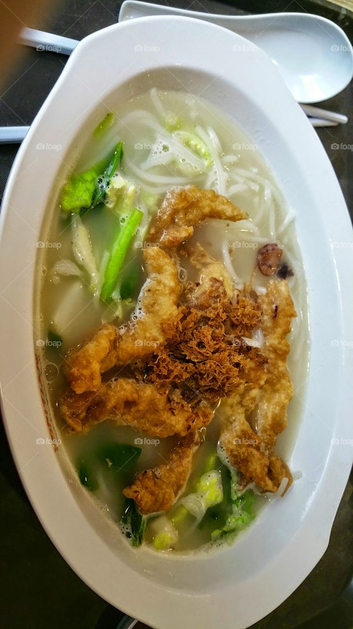 fish soup. a healthy bowl of sliced fish bee hoon