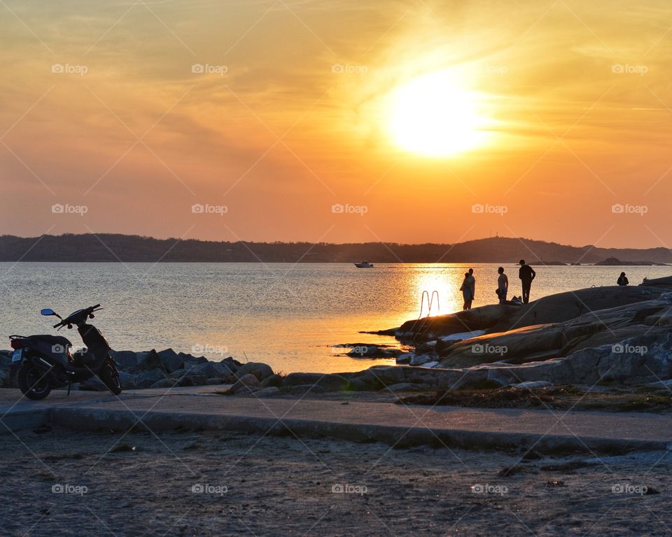 Teenagers watching the sunset.