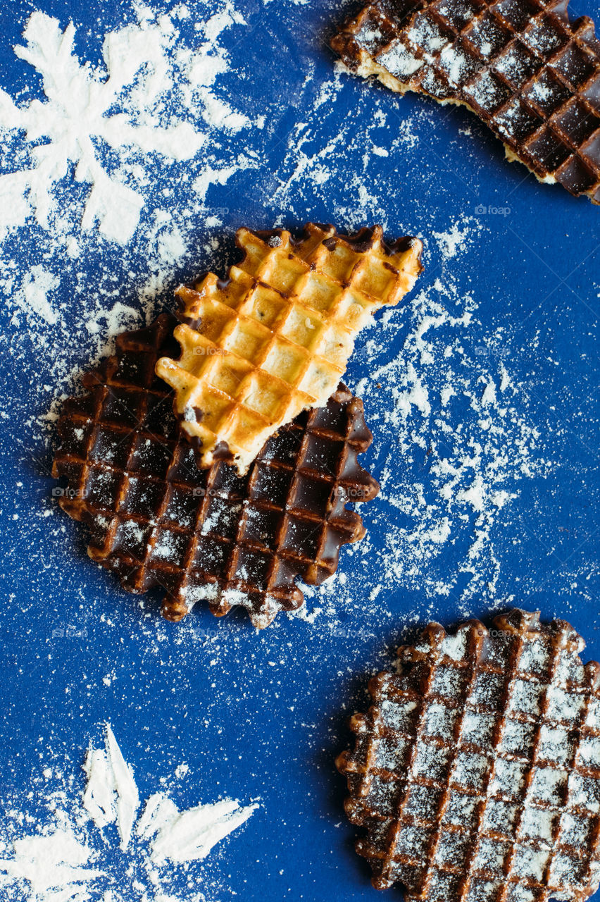 Belgian waffles on snow background