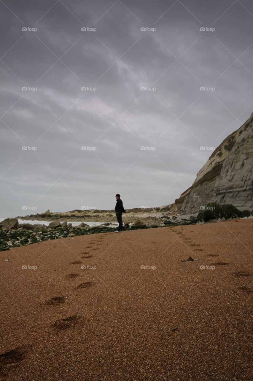 beach stones man rocks by leonbritton123