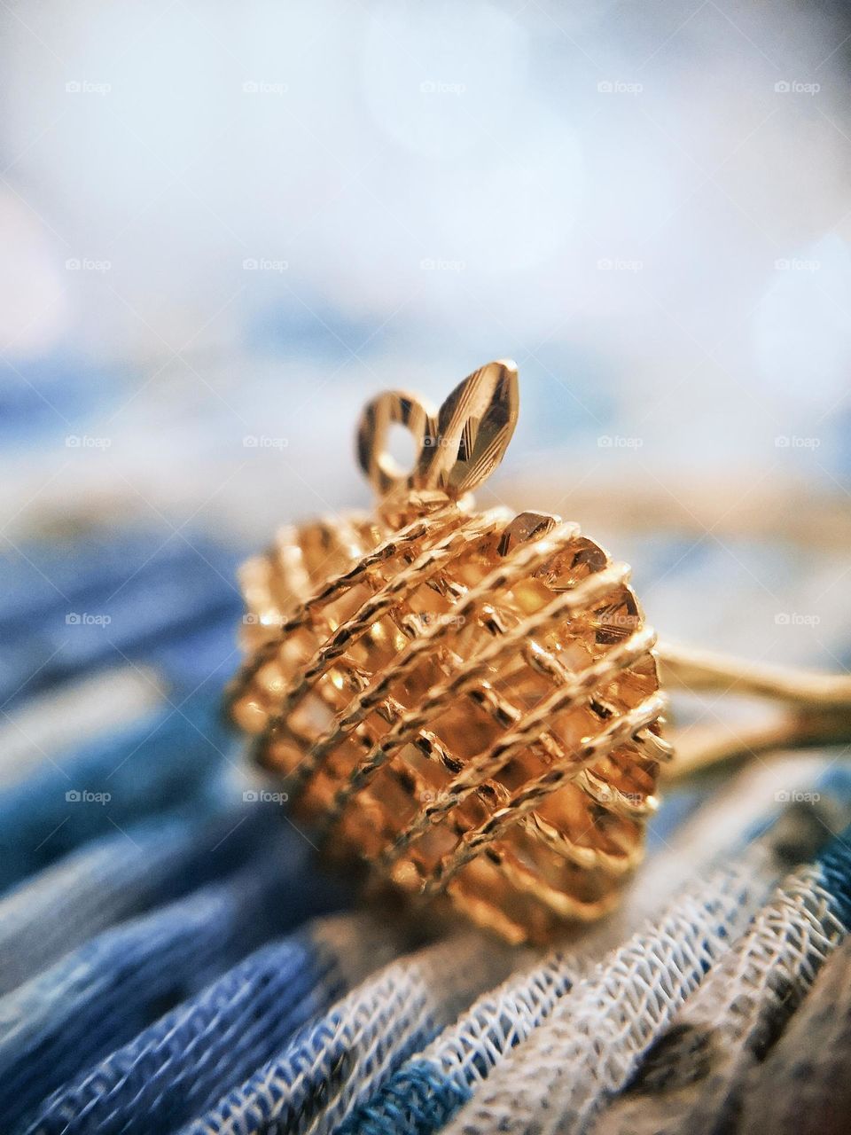 A gold ring that contains rectangles in its design.