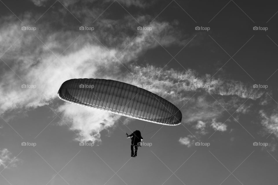 Paraglider up in the sky , carried by light summer winds 