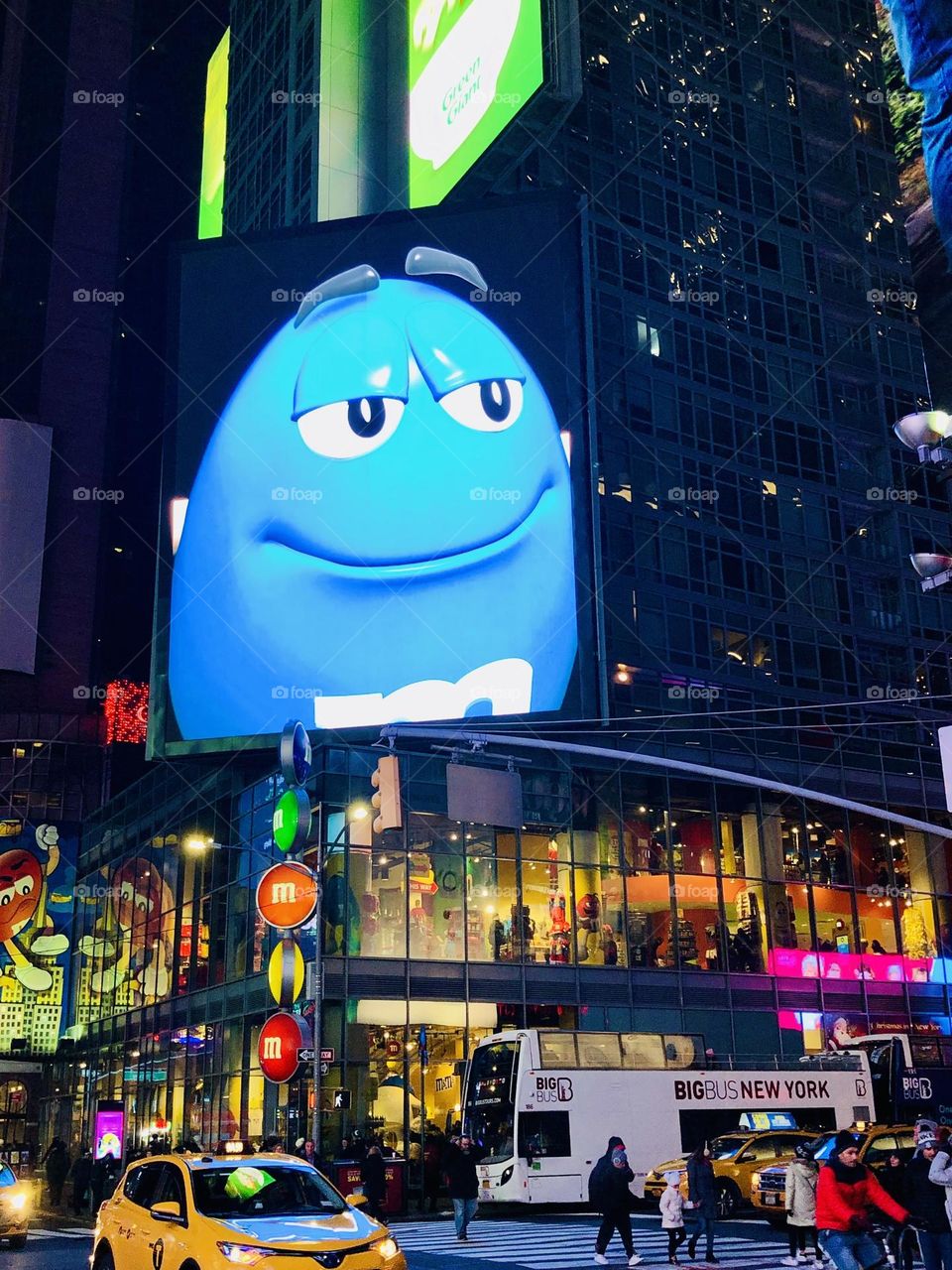 New York, enlightened street in the night, blue M&M’s advertising, New York by night, NY City 