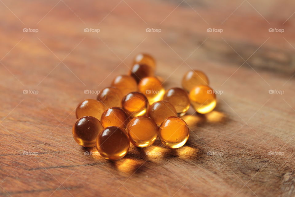 Pills, lights, ice, balls, hand, concrete, pills in hand, beautiful background, glass, round glass, glass balls, LEDs, capsules, bokeh, cave