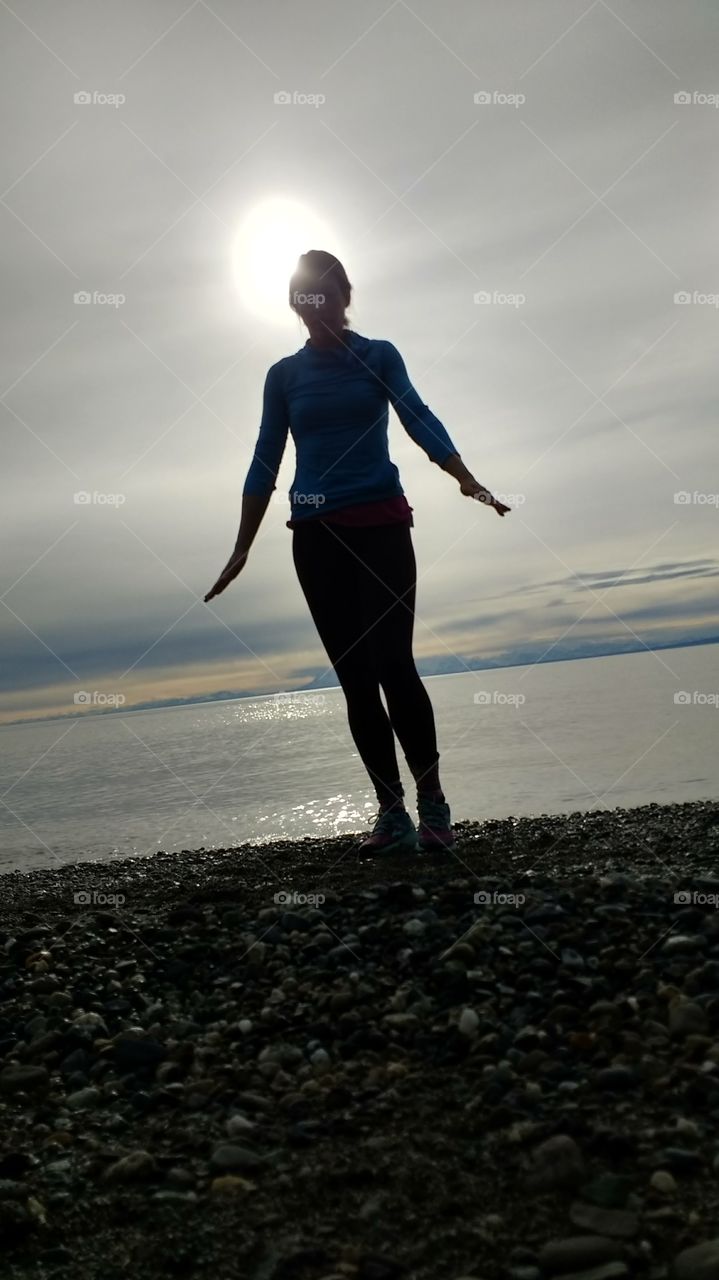 silhouette on stony beach