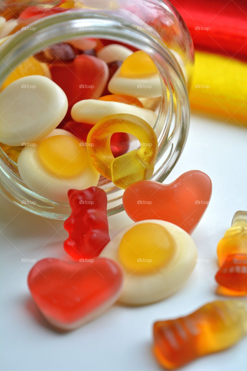 gelatin candy in a jar white background red and yellow tasty