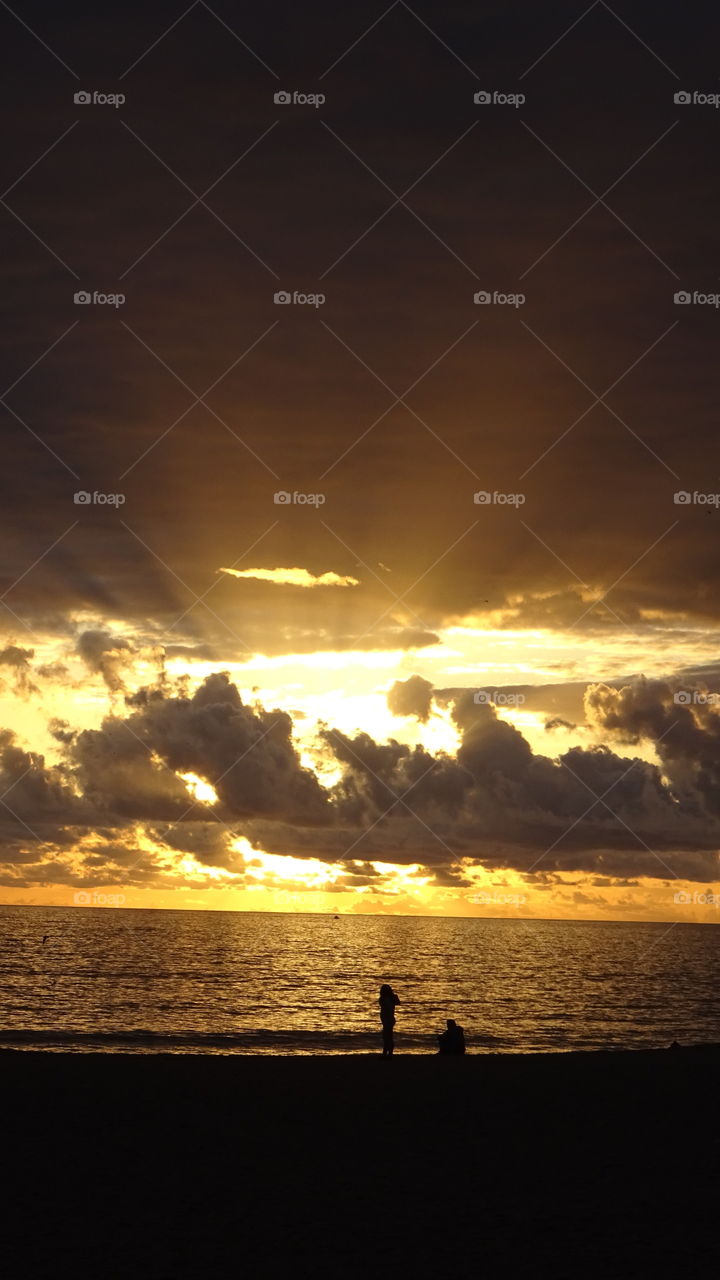 sunset between clouds