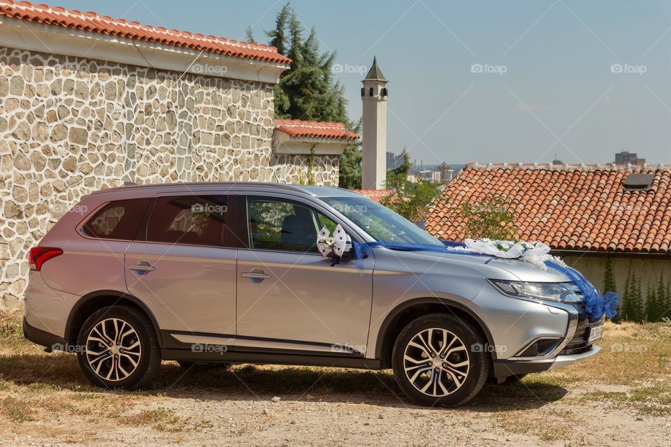 Car decorated with flowers and ribbon for weeding