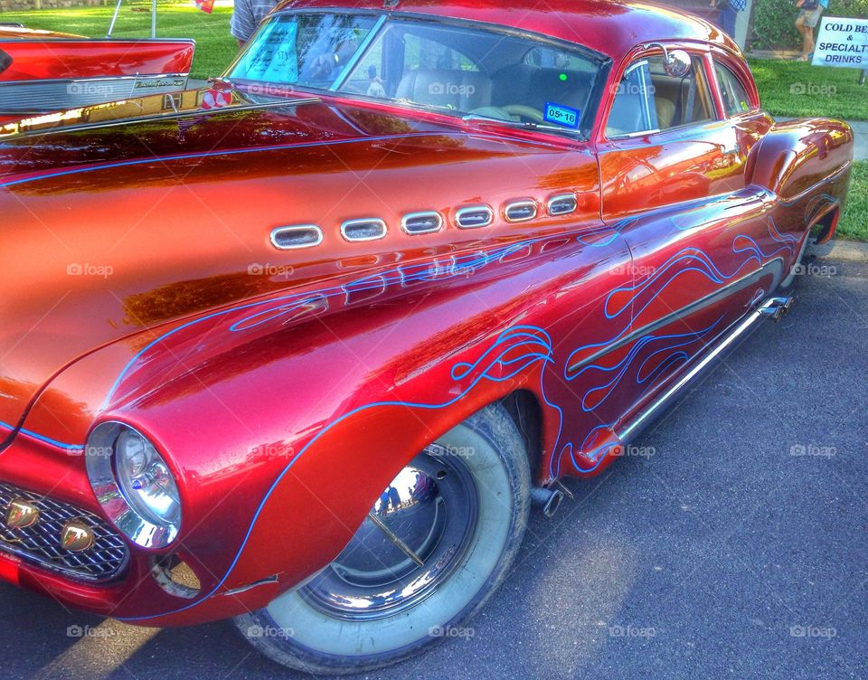 Drive it like it's hot. Classic Hot rod at a car show