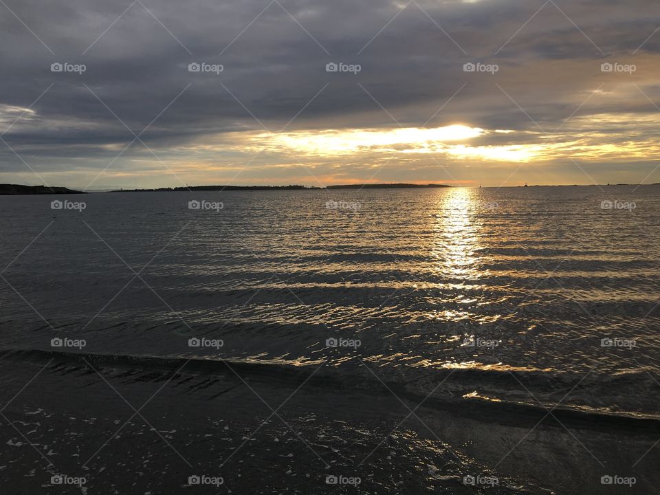 Scenic view of a sea against sunset