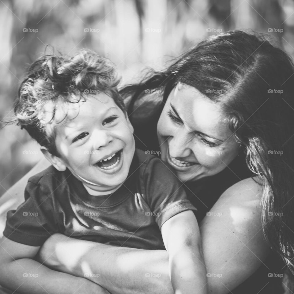 Mother and son laughing.