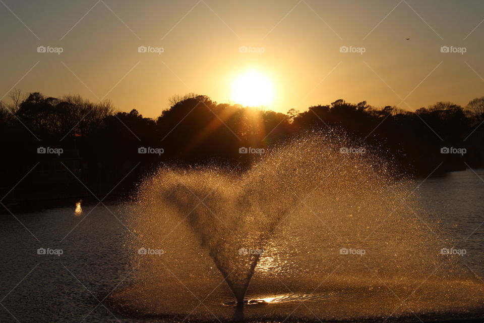 Sunset behind the fountain