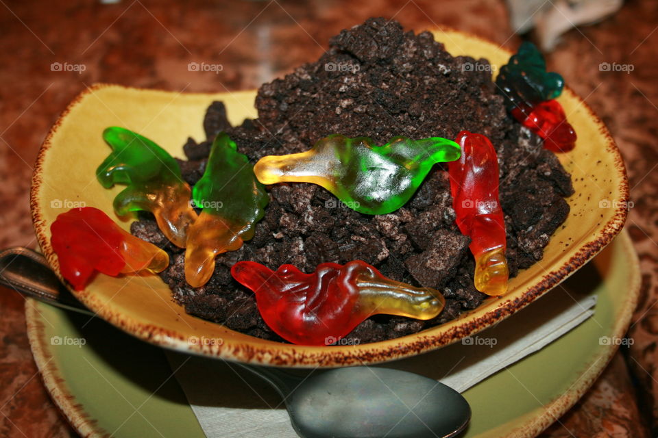 Dinosaur Land. Chocolate pudding, cookie crumbles, gummie dinosaurs 