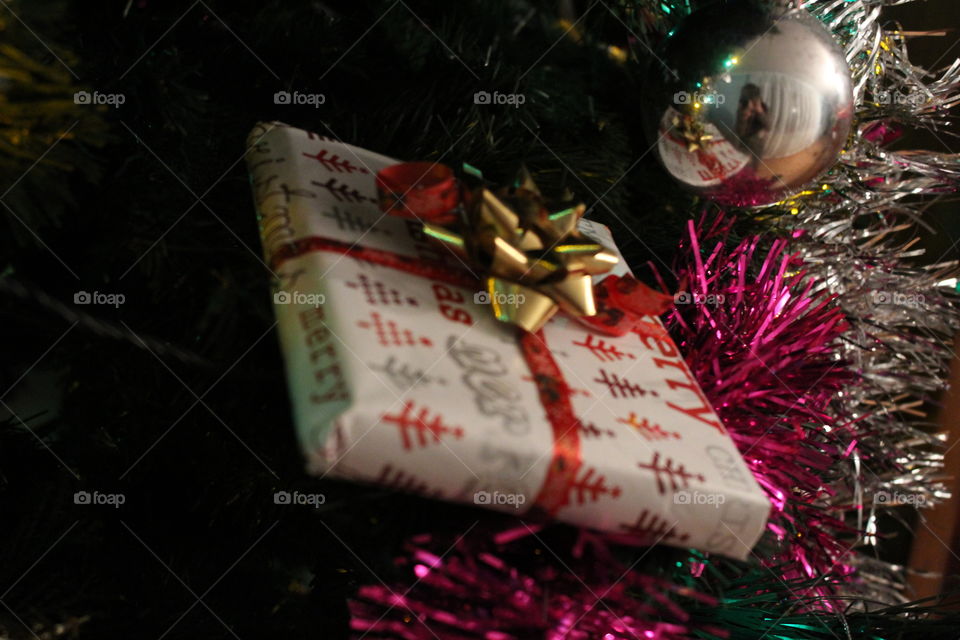 Christmas present on christmas tree