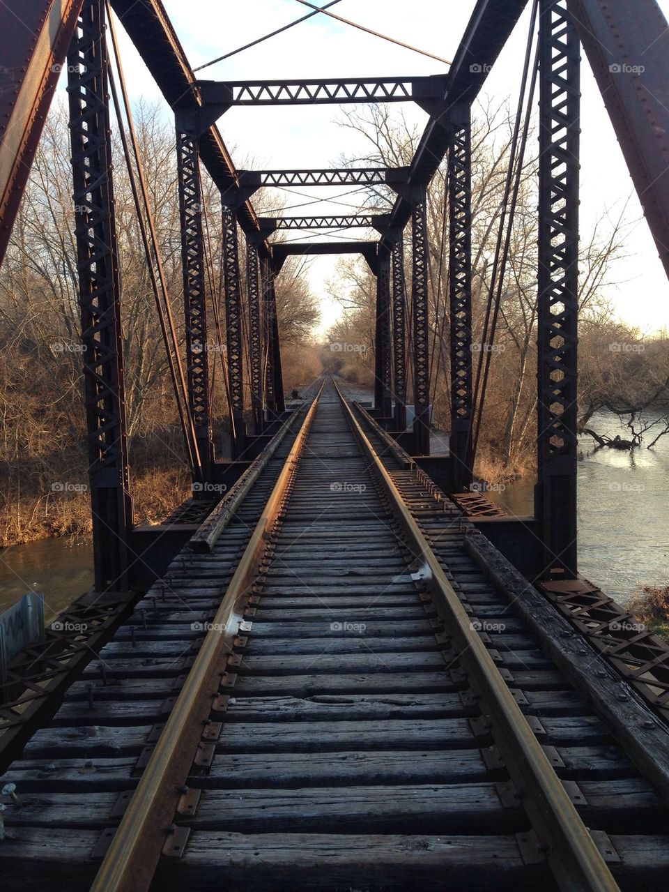 Diminishing view of railroad bridge