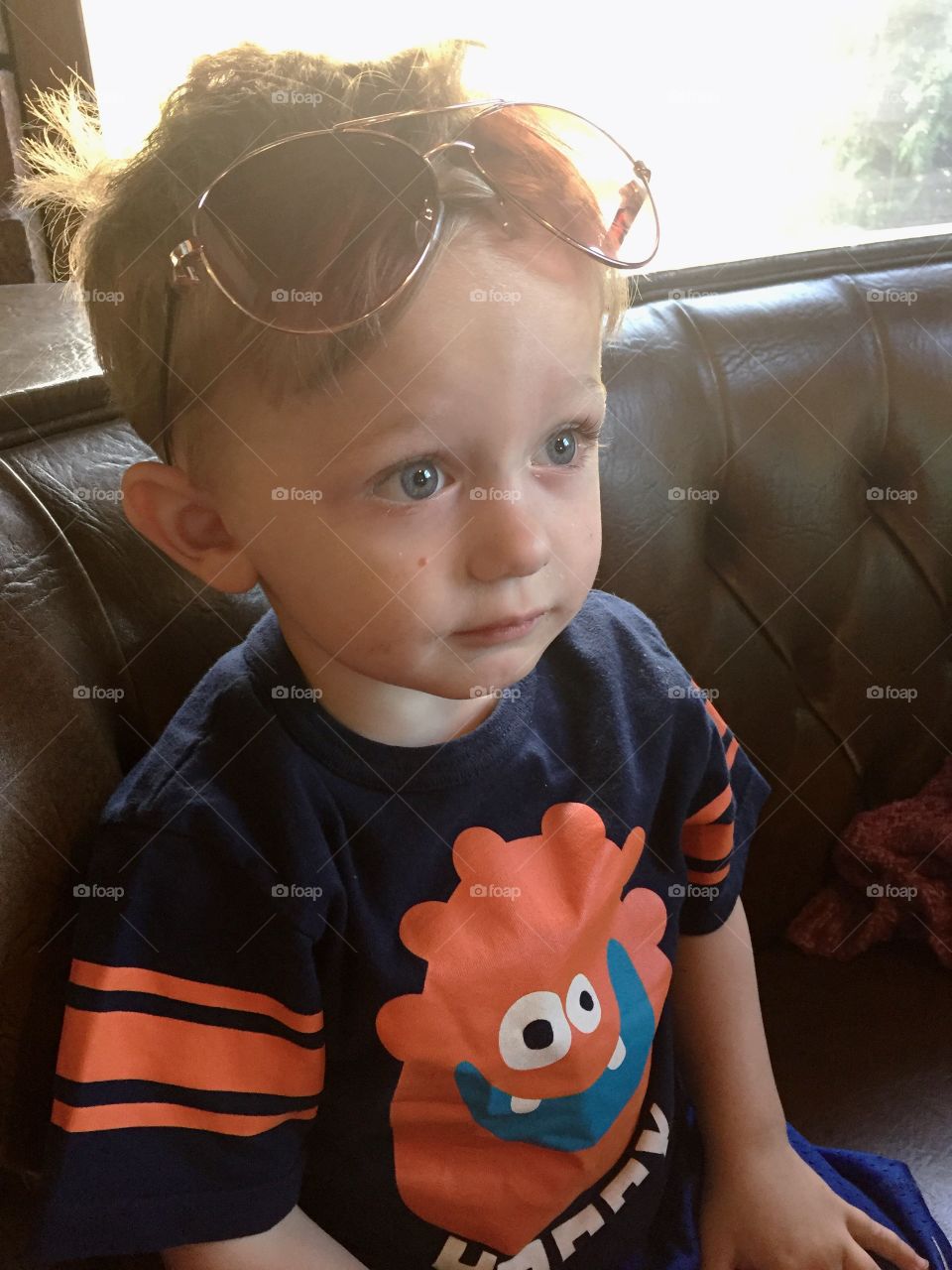 Sad boy sitting on sofa