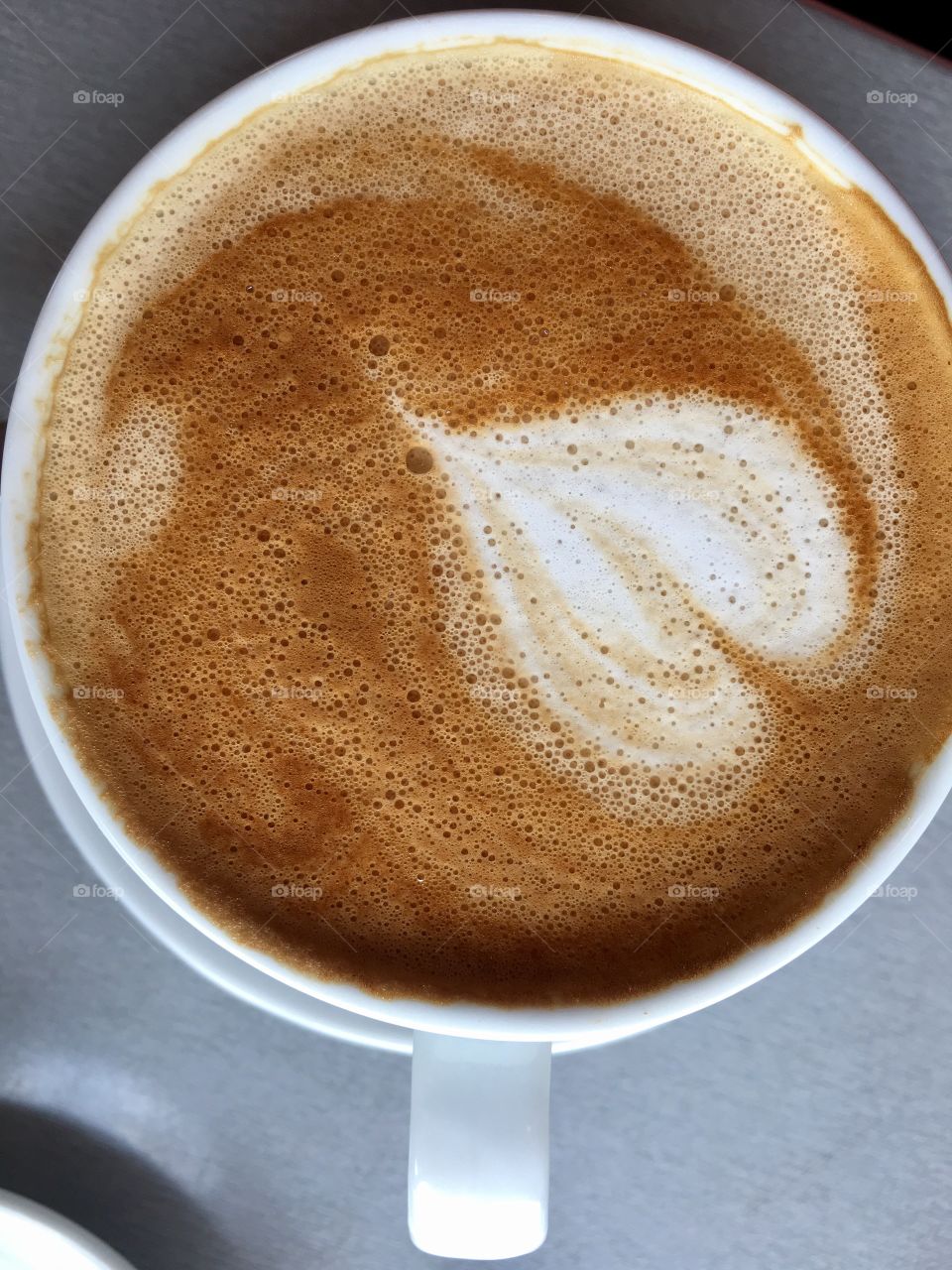 Love in a coffee cup, heart shape in Cafe latte 