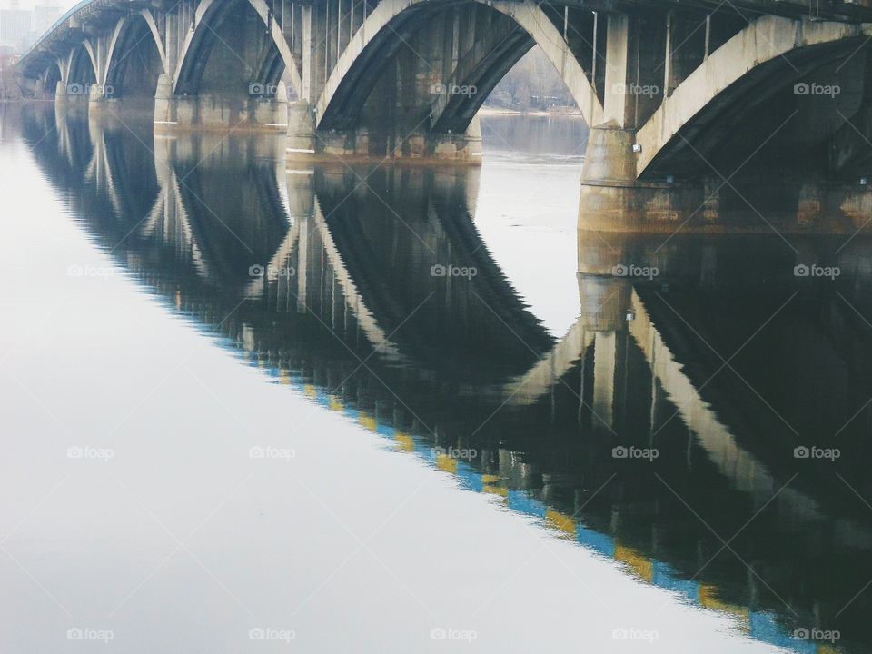 reflection of the bridge in river Dnepr