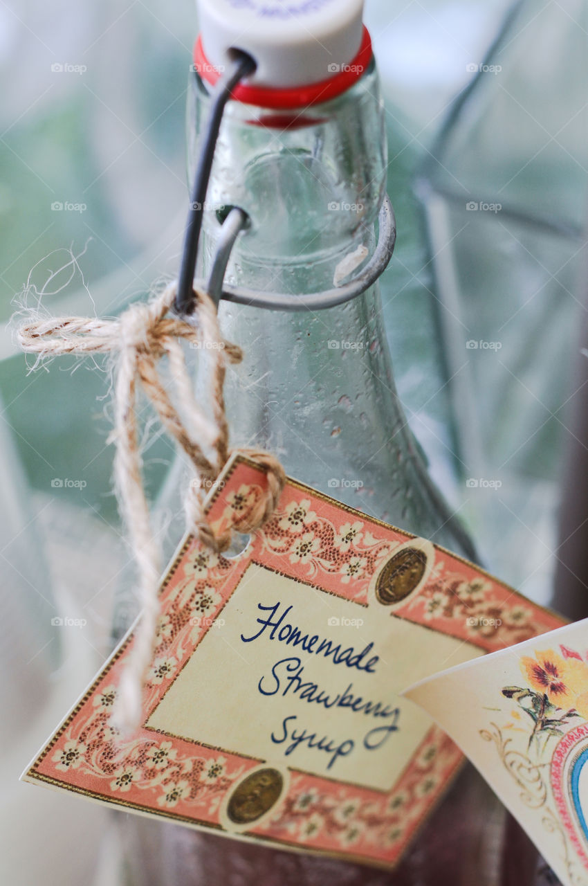 Homemade Strawberry Syrup in a glass bottle