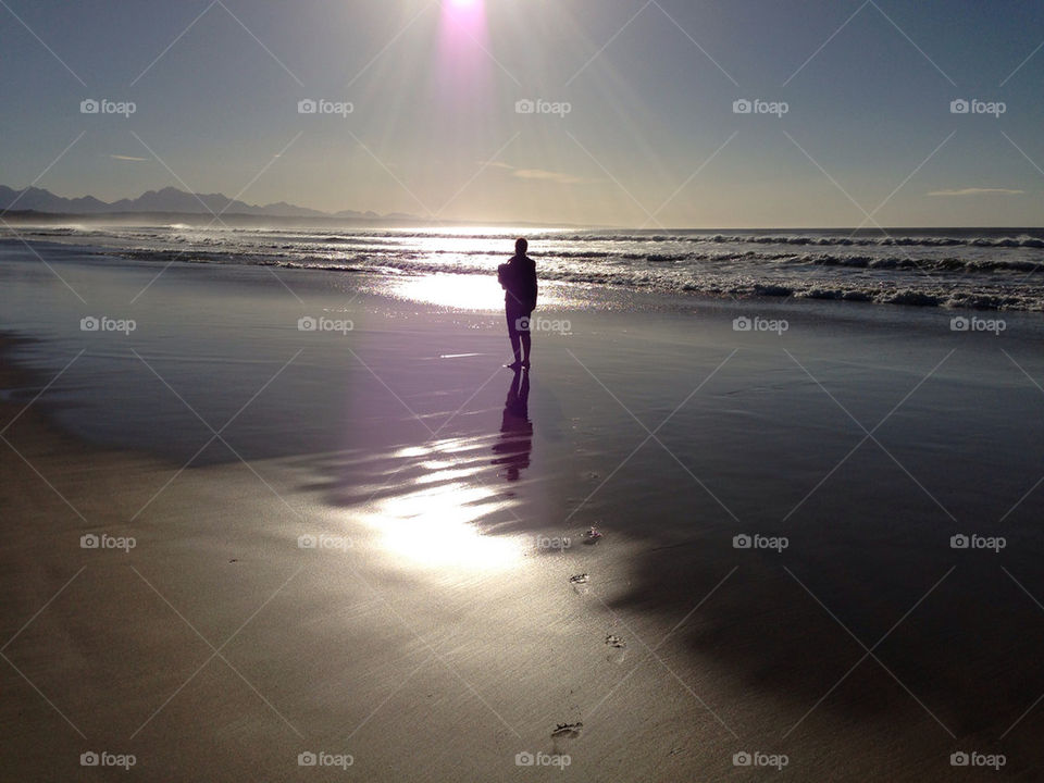 Me walking on beach at sunrise