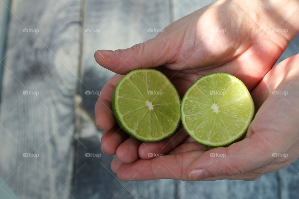 Hands, female hands, lime in hands, lime, fruit, citrus, abstraction, food, still life