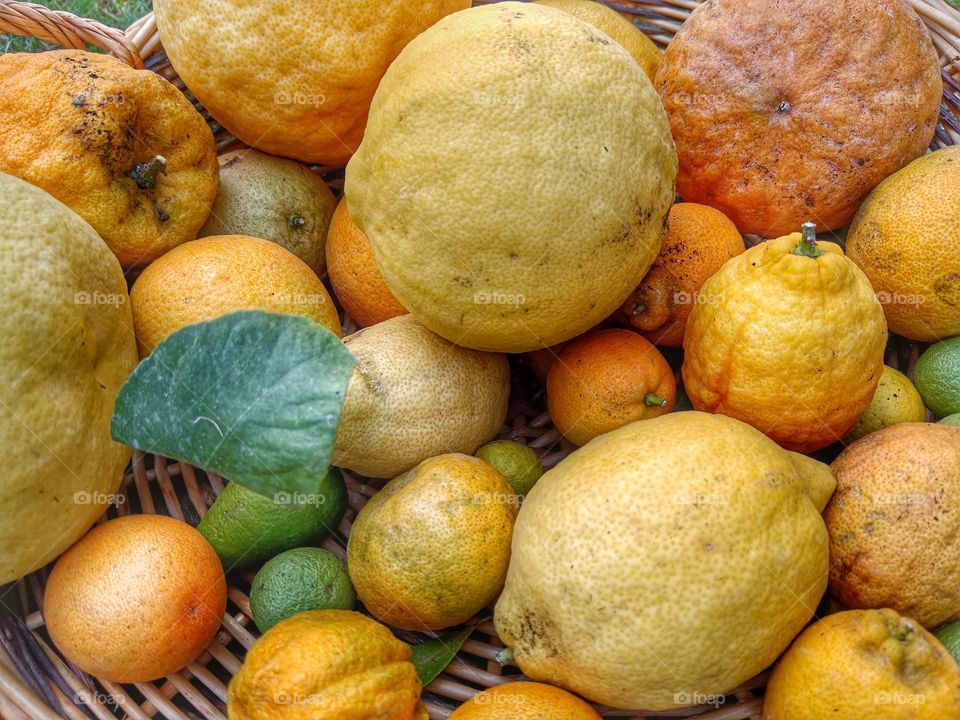 Close-up of some lemons in a basket