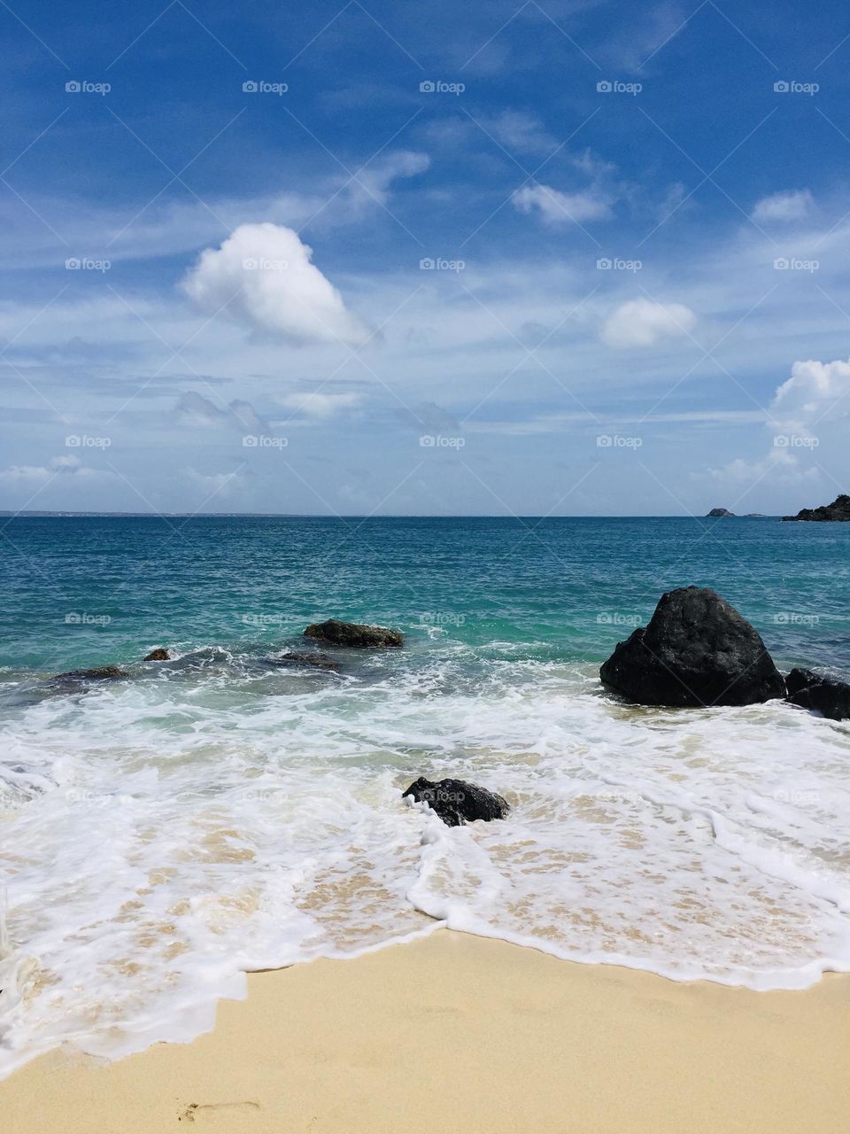 Waves crashing on the beach, seaside view, happy bay beach in St. Maarten, Caribbean island views, vacation getaway, waking and exploring in the Caribbean 