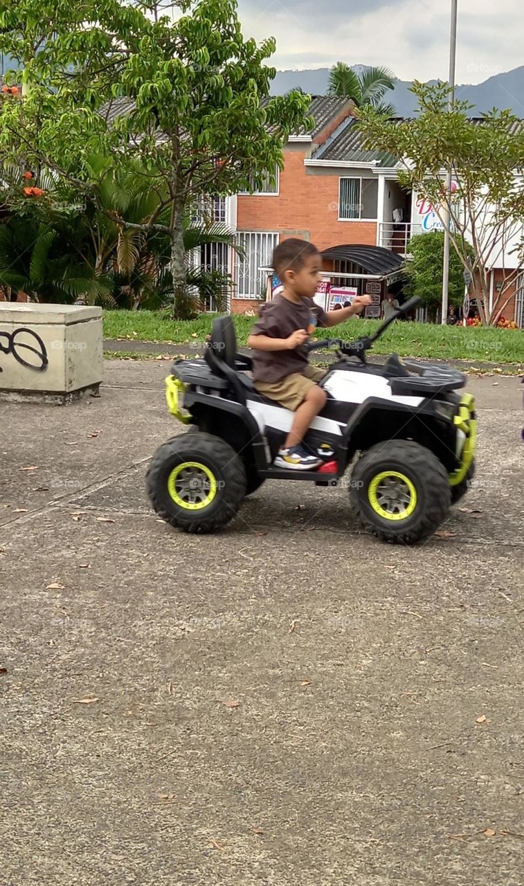 boy driving motorcycle