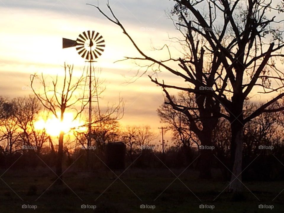 windmill at sunset, landscape view